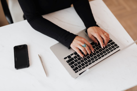 Person typing on a laptop